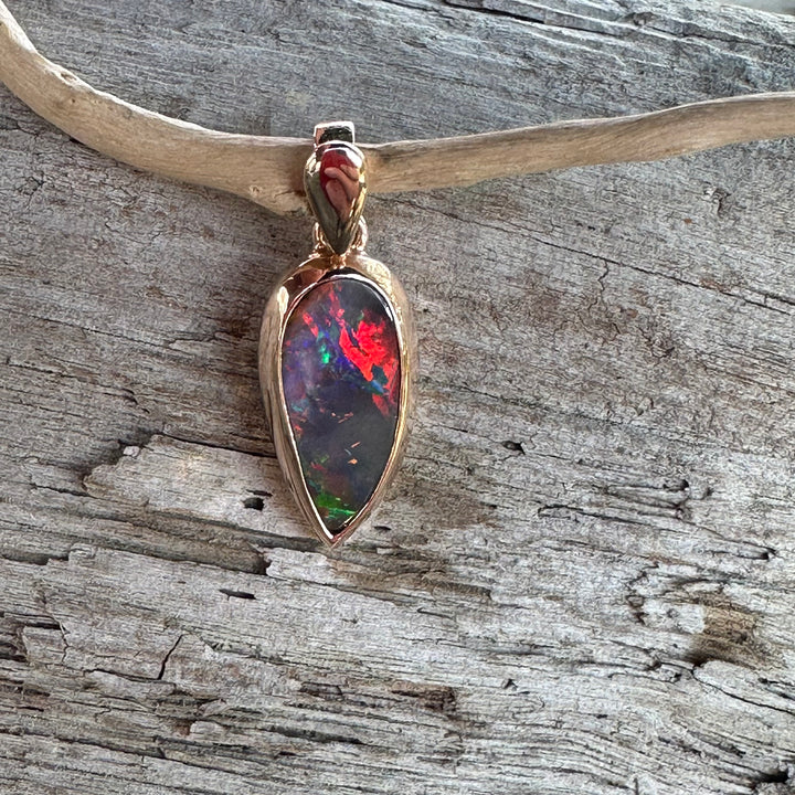 Fiery Boulder opal pendant