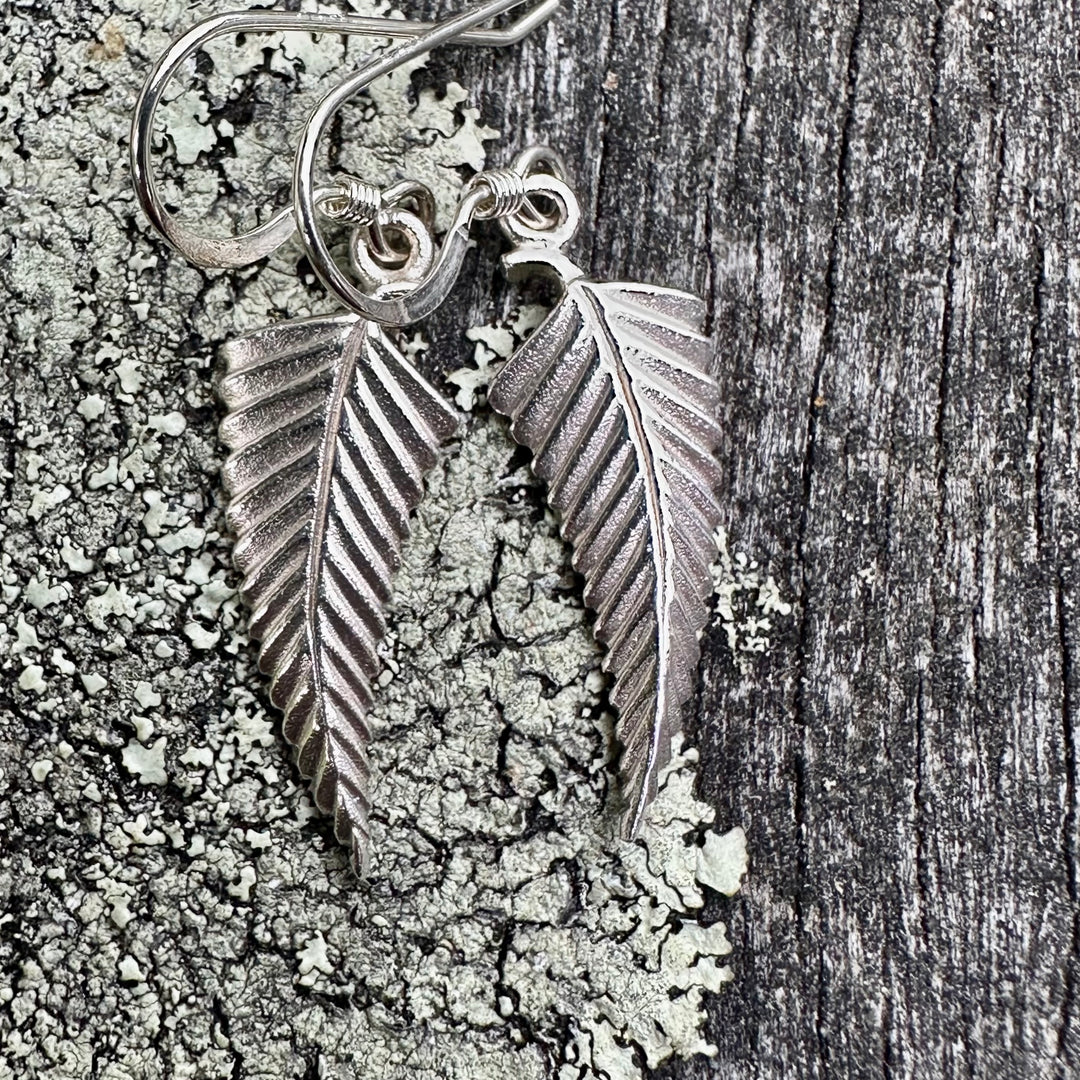 Small silver fern earrings