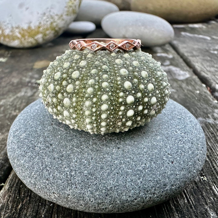 Wee 9 carat rose gold & diamond ring