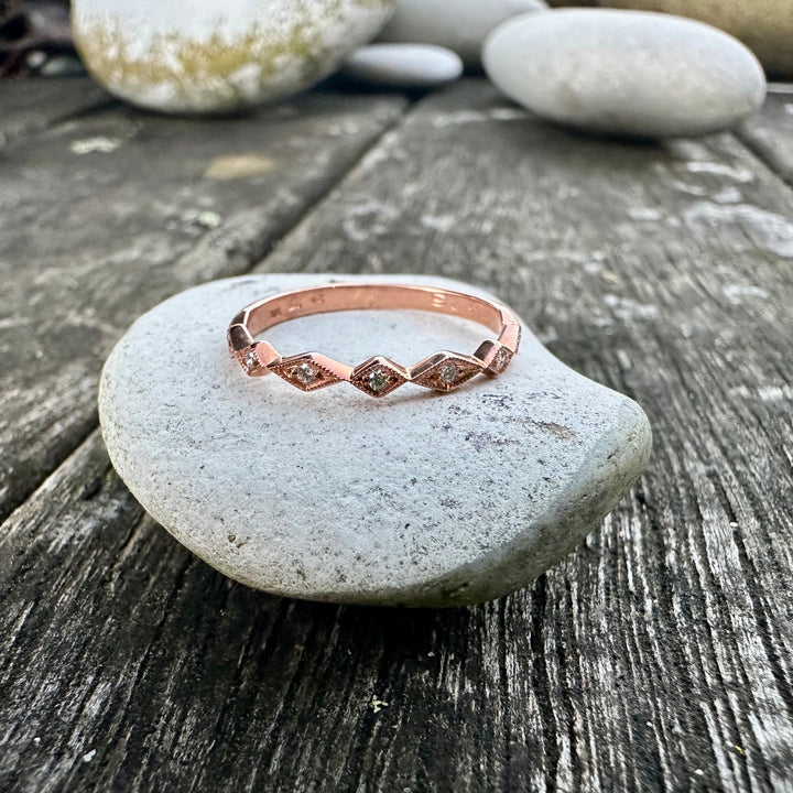 Wee 9 carat rose gold & diamond ring