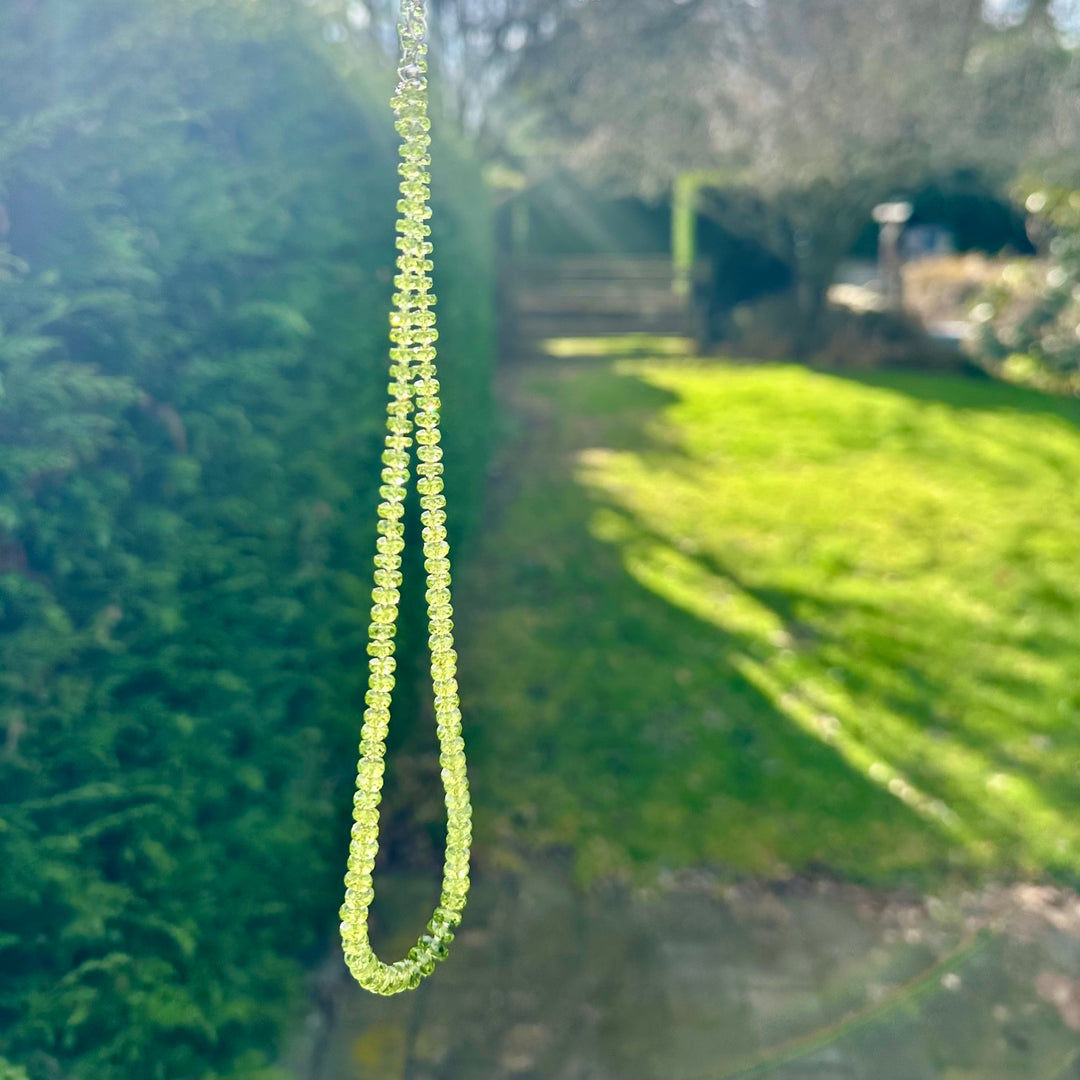 Faceted peridot rondel necklace