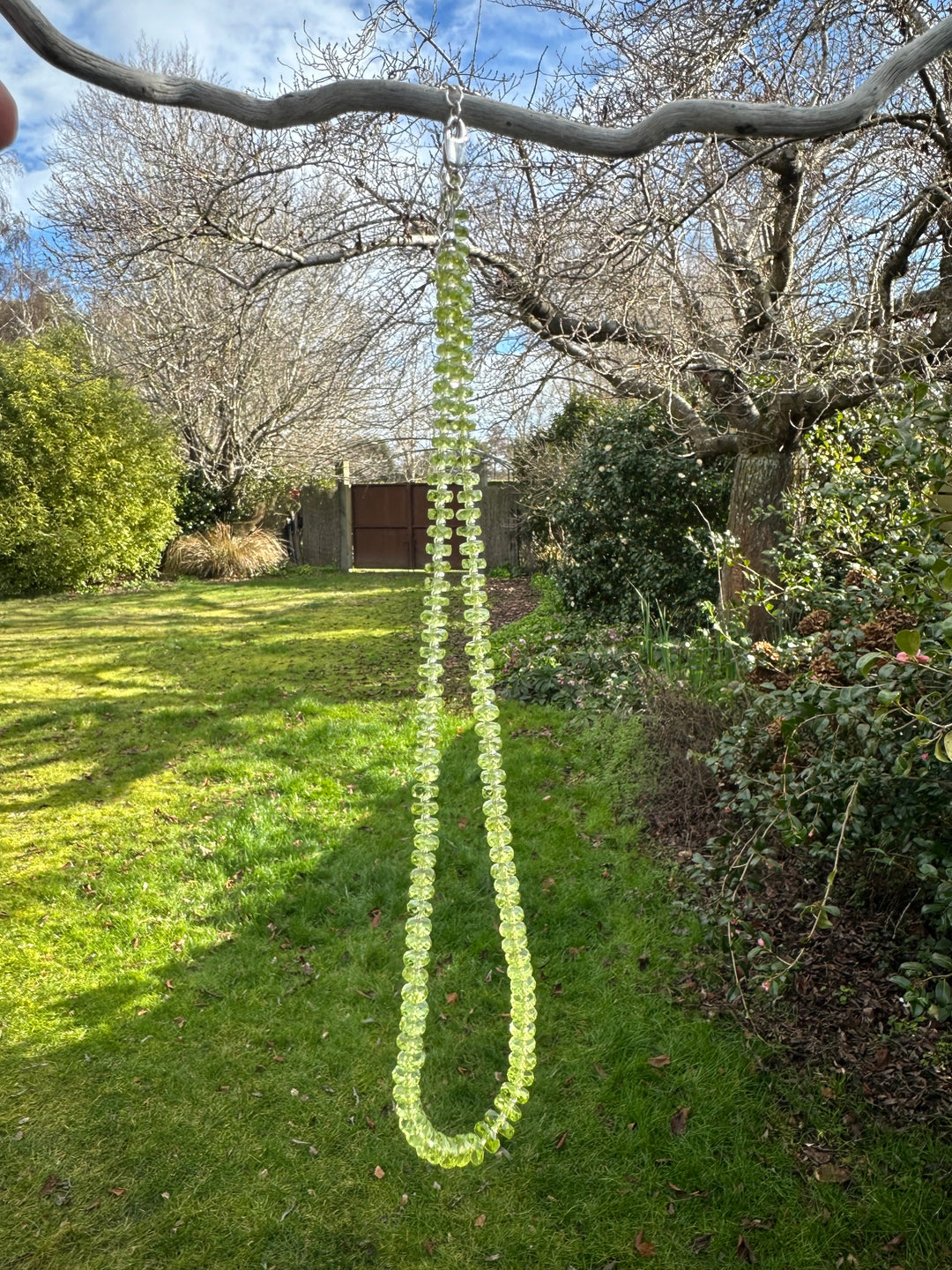 Faceted peridot rondel necklace