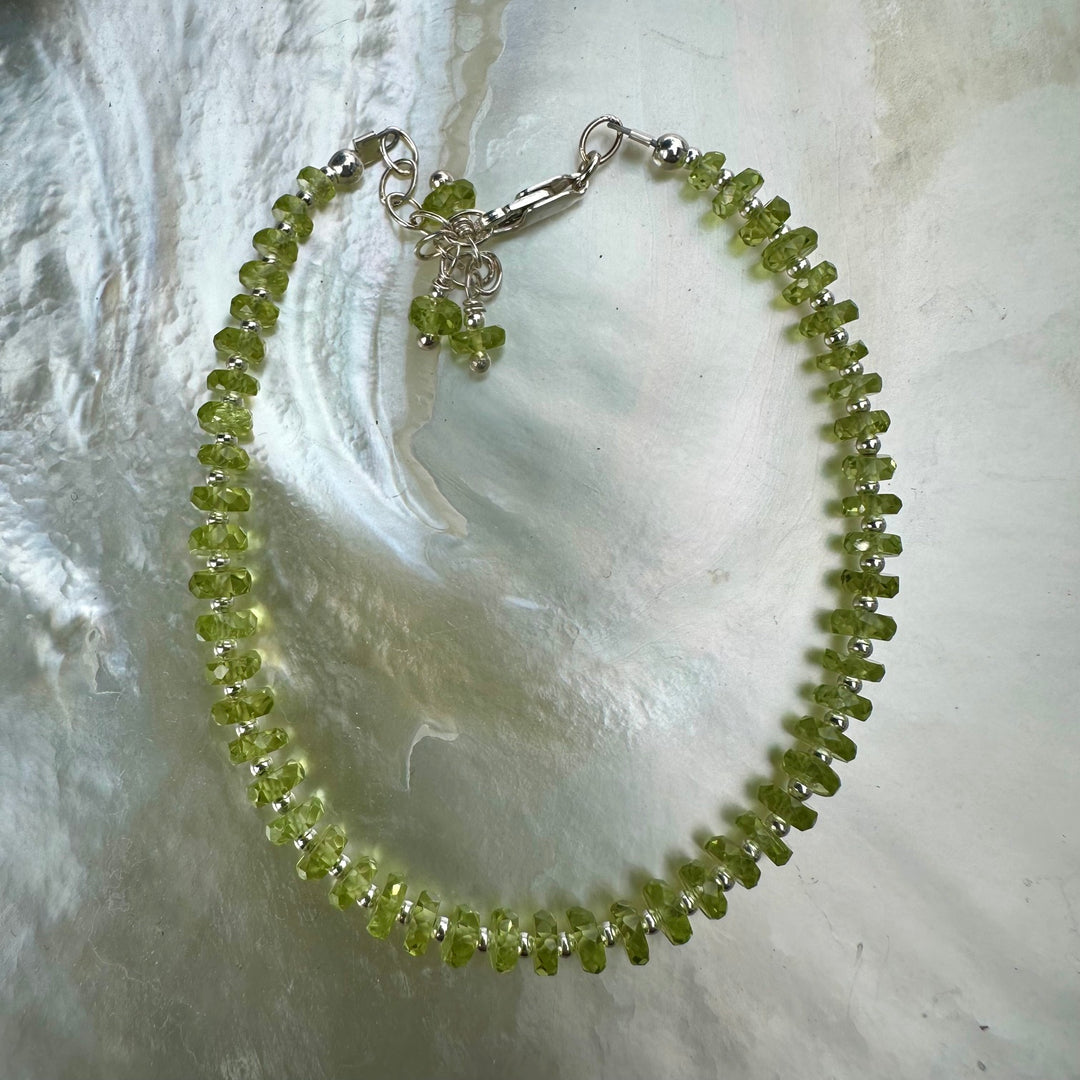 Faceted peridot rondel bracelet