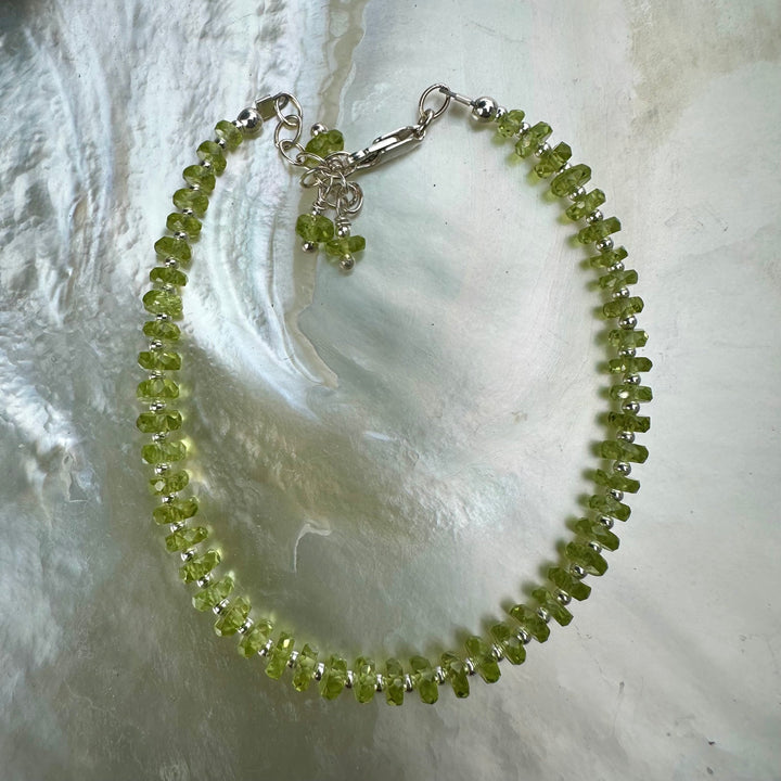 Faceted peridot rondel bracelet