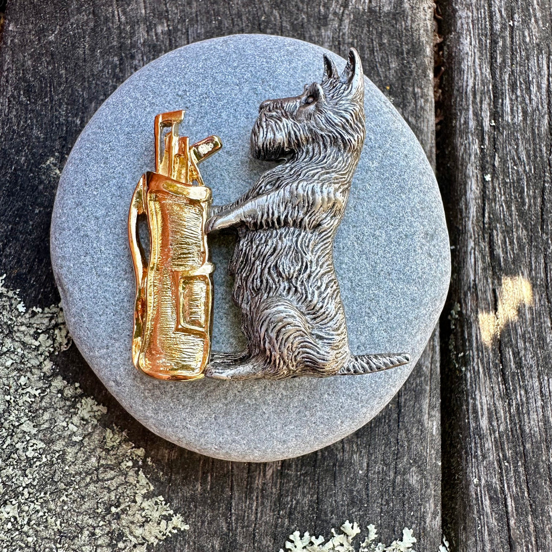 Vintage pewter scotty with golf clubs