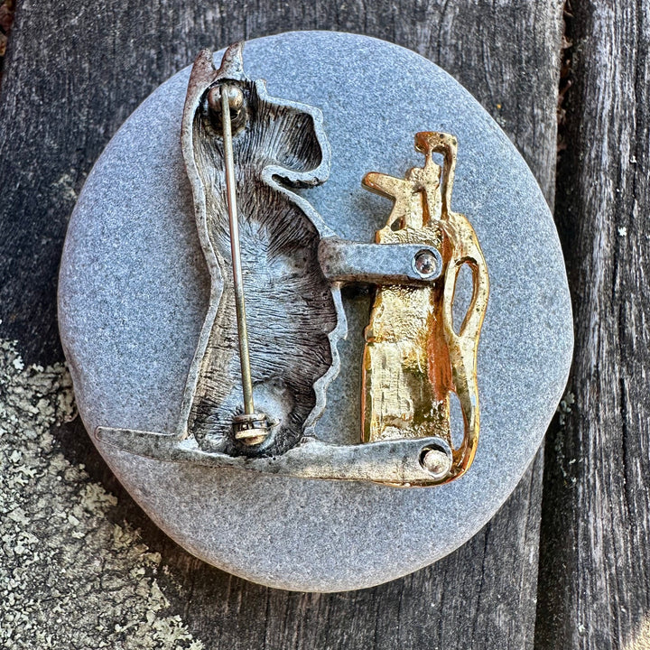 Vintage pewter scotty with golf clubs
