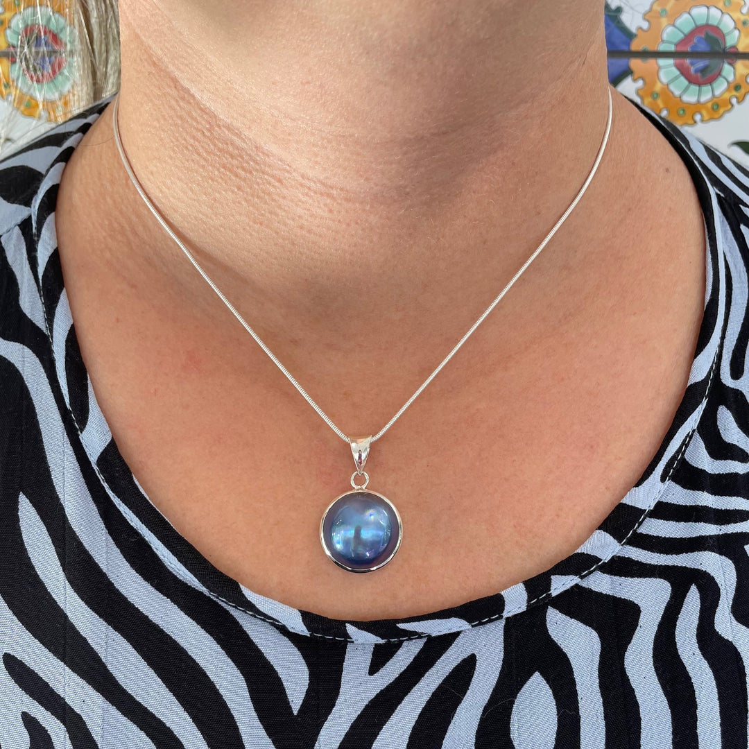 Peacock mabe pearl pendant