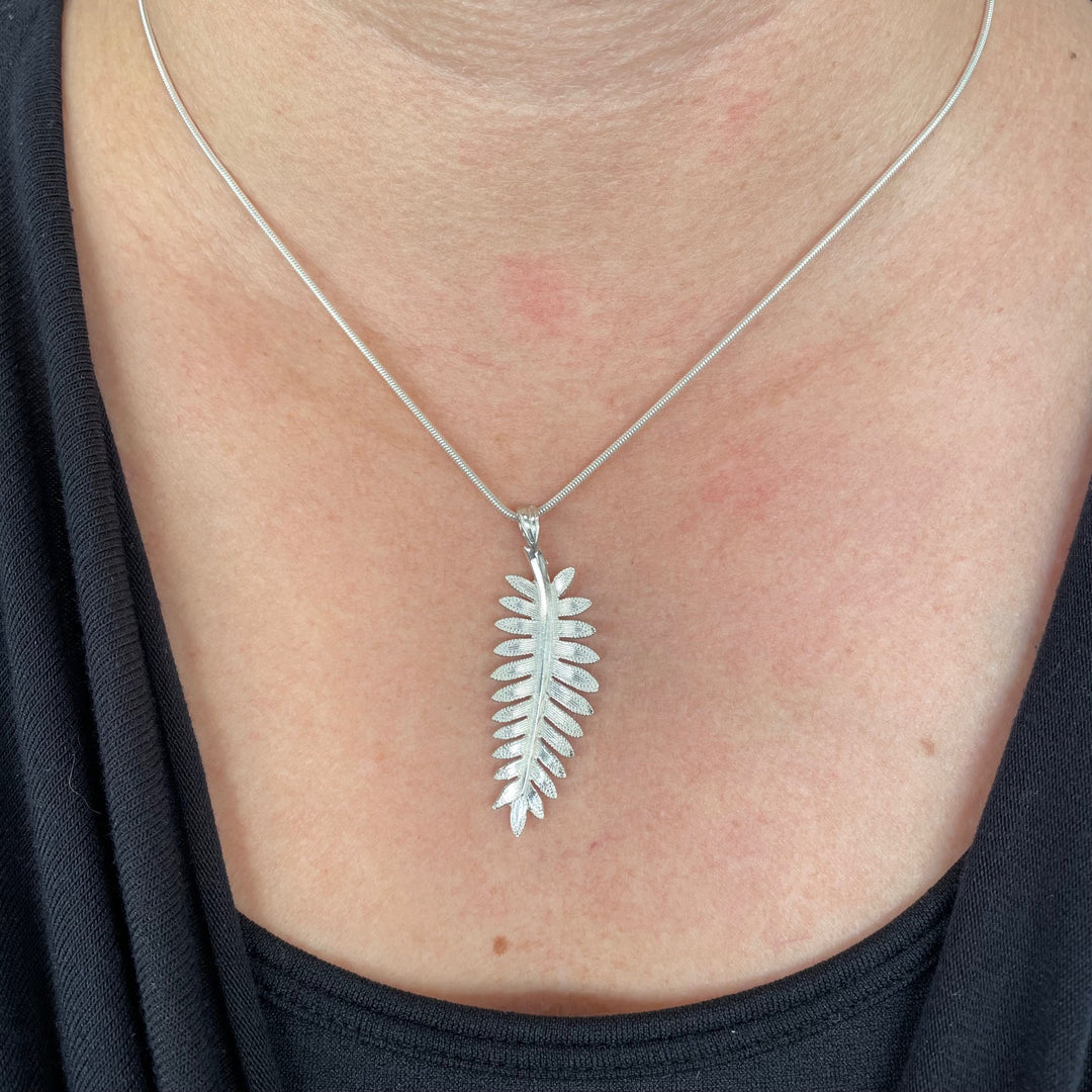 silver fern pendant