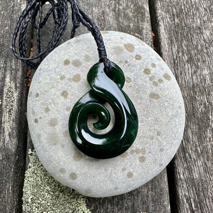 Dark New Zealand greenstone rau kumara koru
