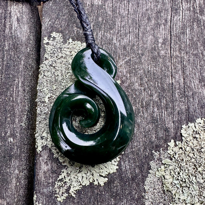Dark New Zealand greenstone rau kumara koru