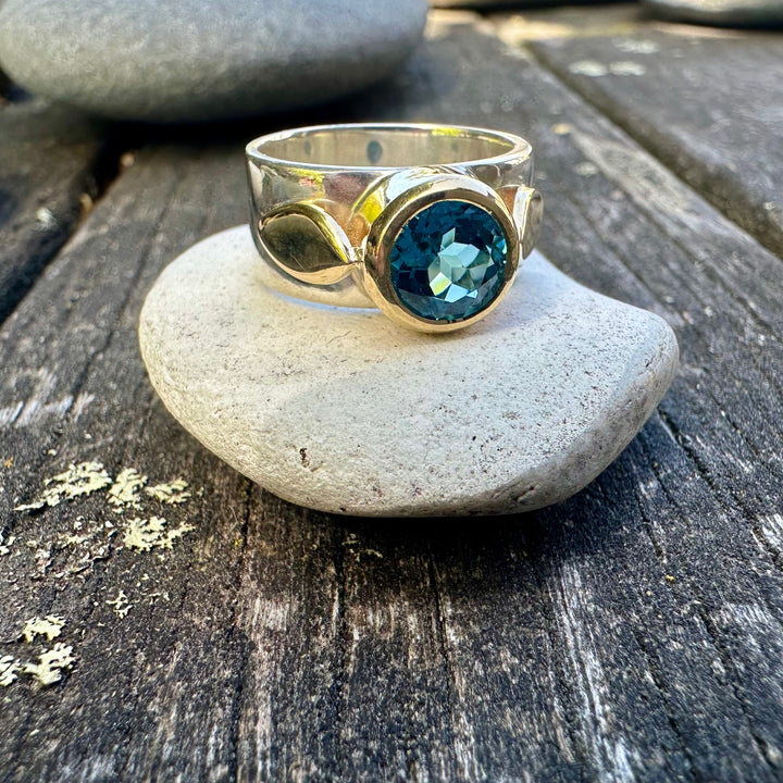 Faceted swiss blue topaz Amore ring