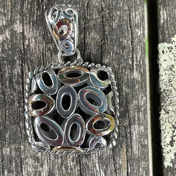 Sterling silver and 18 carat pendant